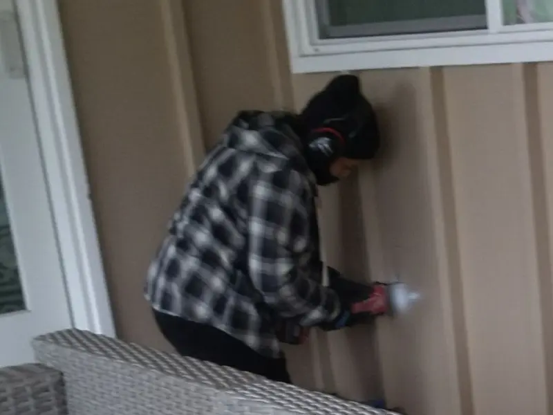 Professional electrician installing an exterior outlet in Hazard