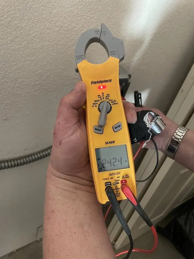 Voltage testing with clamp meter during Recessed Lighting Installation in Hazard